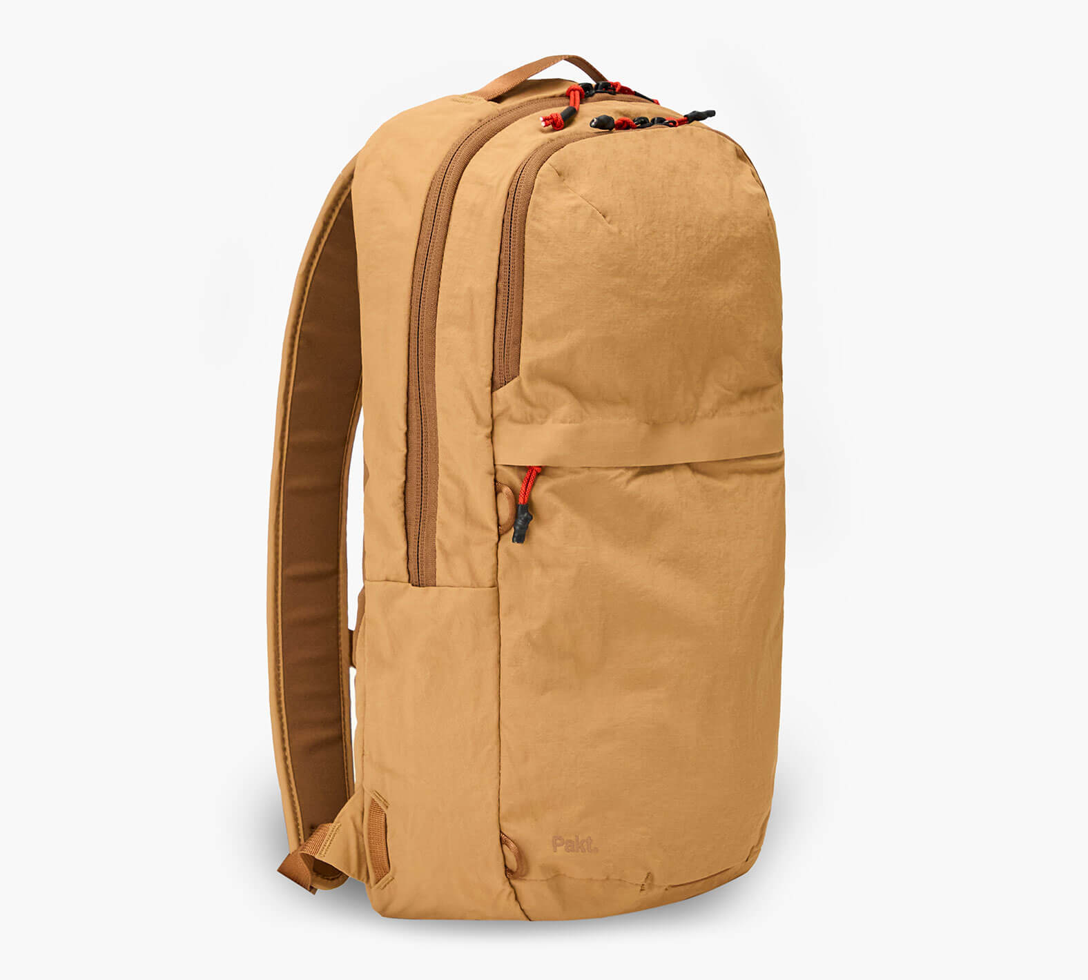 Tan packable 16L backpack, side view with red zipper pulls and Grandcart. logo