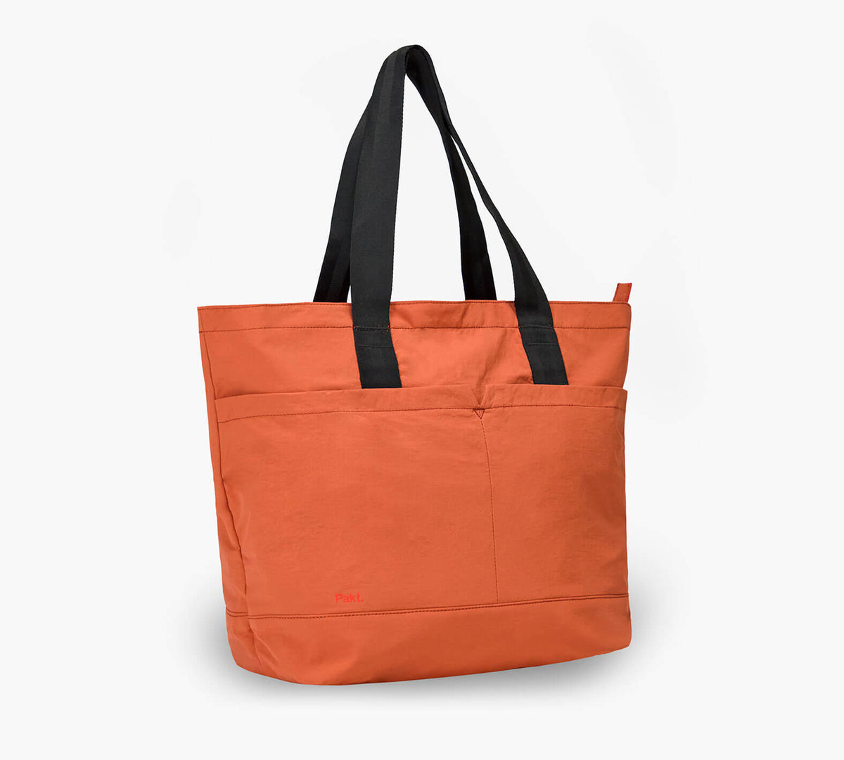 Orange packable tote with black straps, front pockets and 'Pakt.' logo, 20L capacity