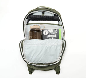 Open Stash Packable Backpack 16L showing interior with a water bottle and a book