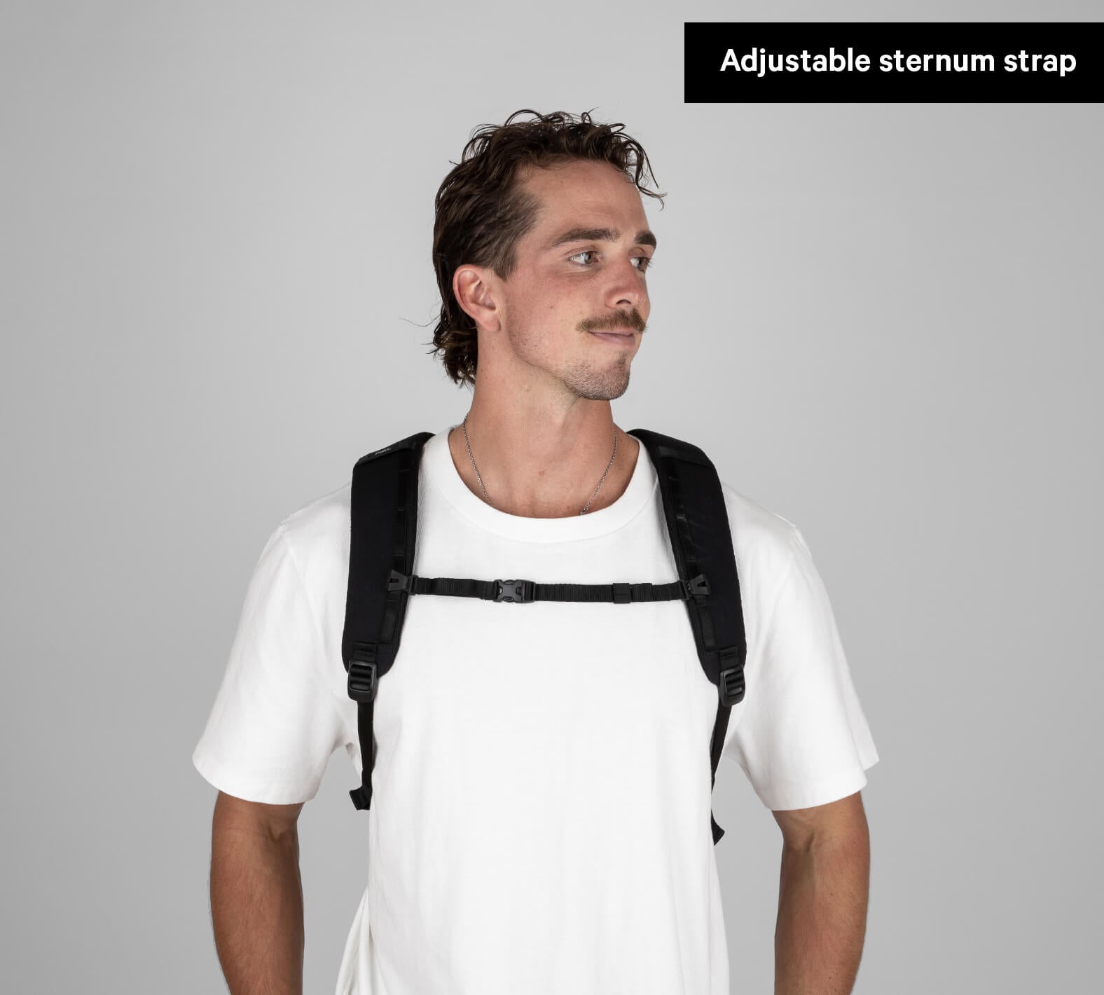 Man wearing a black Everyday 22L Backpack with adjustable sternum strap visible