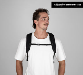 Man wearing a black Everyday 22L Backpack with adjustable sternum strap visible