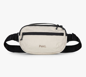 Beige Everyday 3L Sling with black strap and 'Pakt.' logo on front.