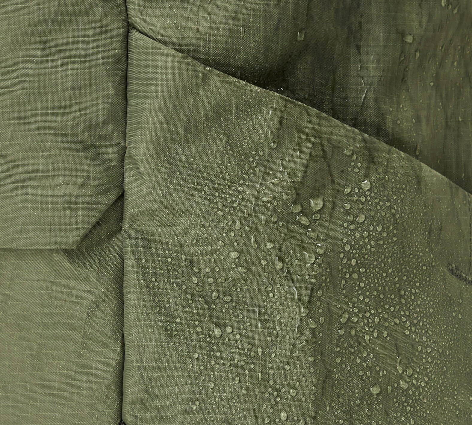 Close-up of the Aeroweave fabric in Cypress with water droplets, highlighting water-resistant material