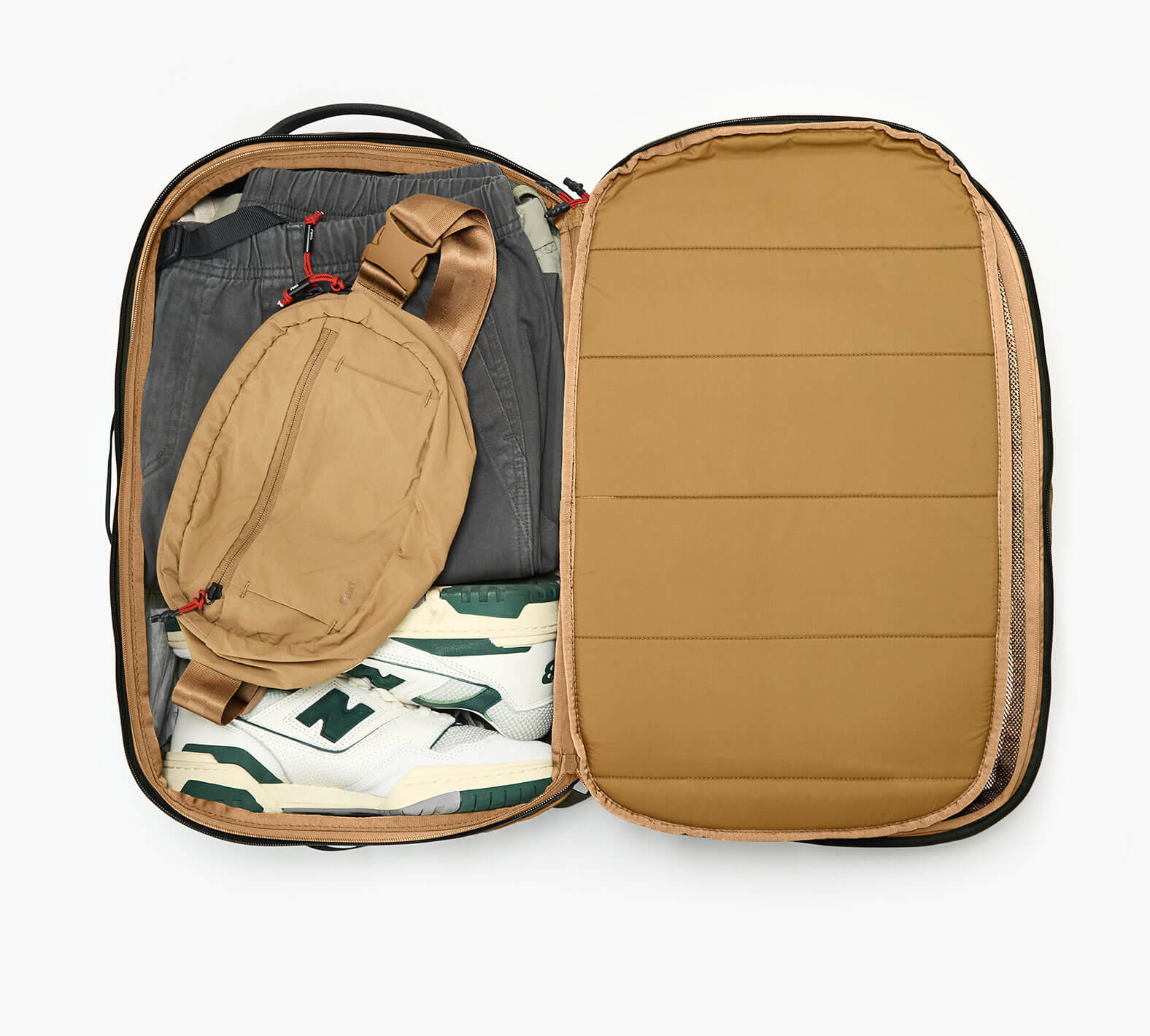 An overhead shot showing the interior of the Aero Travel Backpack in Black.