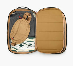 An overhead shot showing the interior of the Aero Travel Backpack in Black.