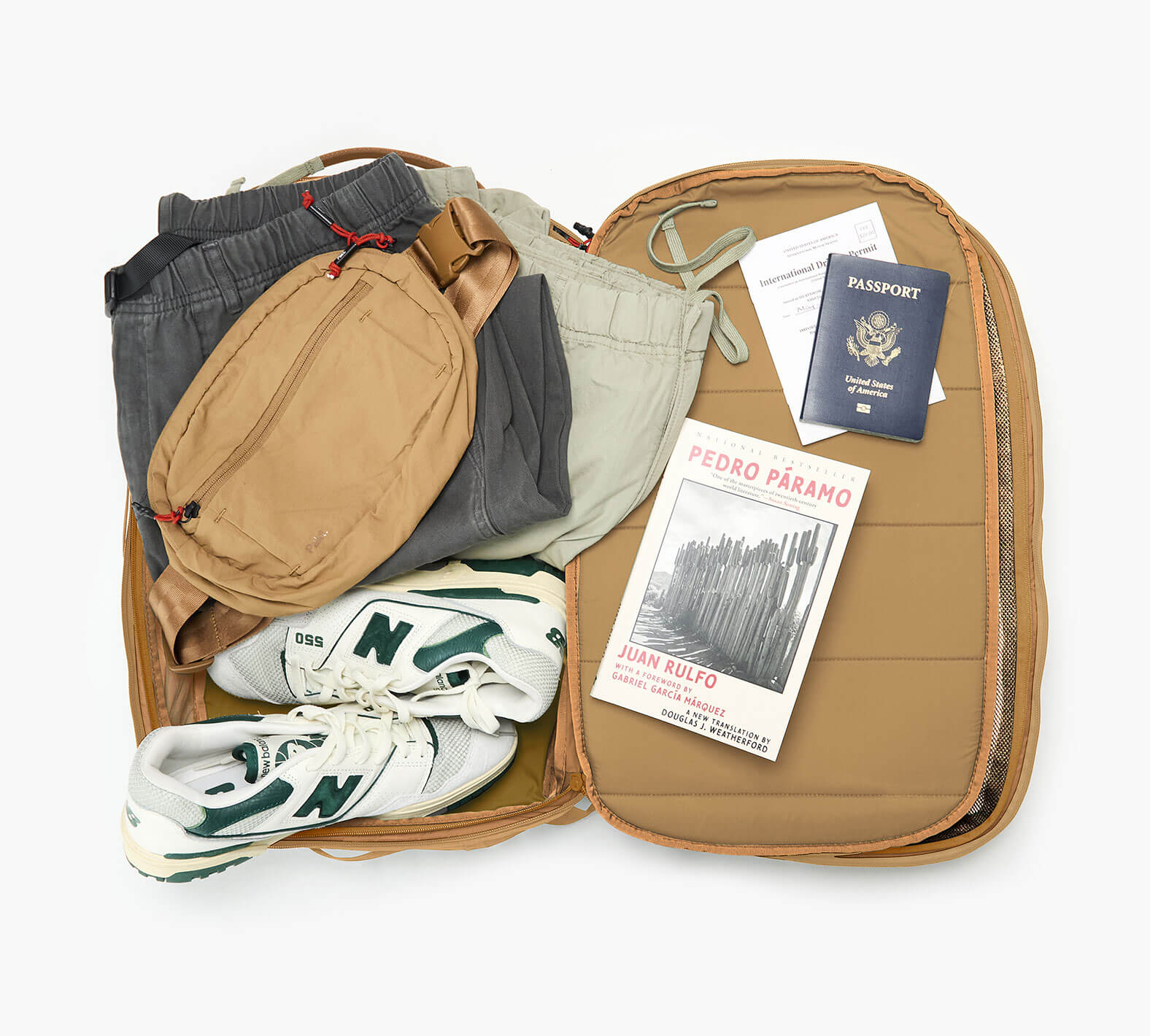 An overhead shot showing the interior of the Aero Travel Backpack in Mojave.