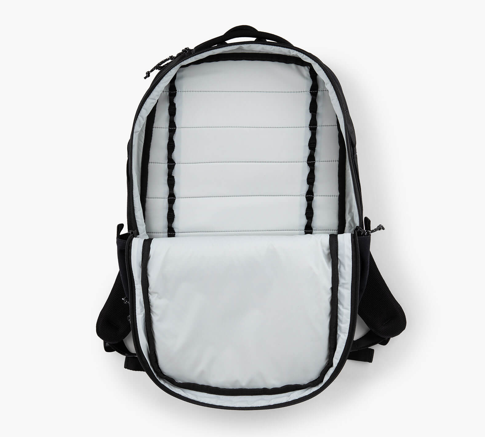 Open backpack with light-gray lined interior, padded laptop sleeve and vertical webbing loops