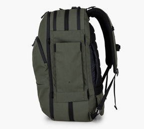 Side view of a forest Travel Backpack with multiple compartments and black straps.