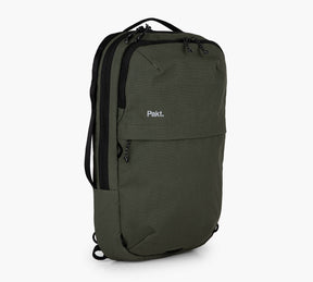 Olive green rectangular travel backpack with 'Pakt.' logo, front zip pocket and top handle.