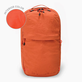 The Stash 16L Packable Backpack in Sumac on a white background. To the left there is a circular swatch showing the interior color of Sumac.