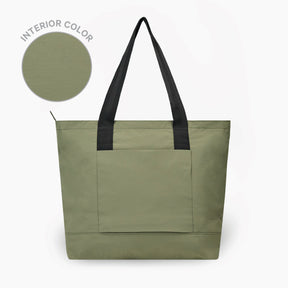 The Stash Tote in Cypress with black handles on a white background. To the left there is a circular swatch showing the interior color.